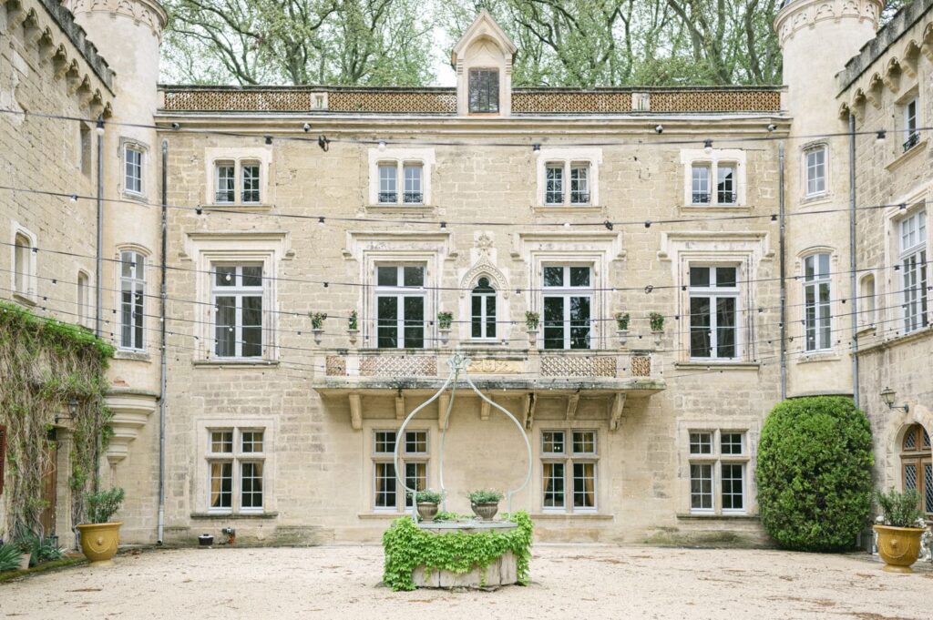 the façade of the Château de Beauregard in the Vaucluse, adorned with garlands of lights